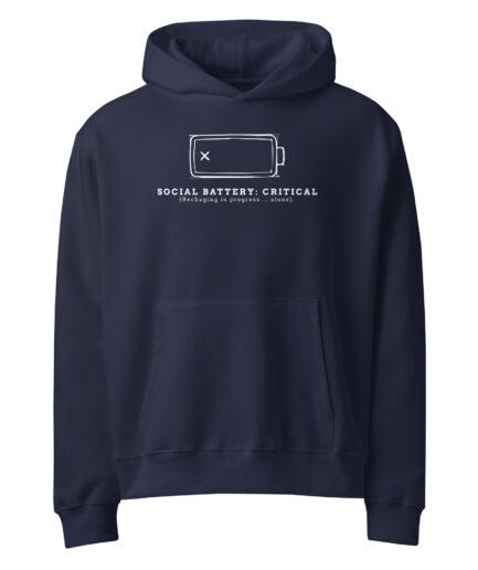 Introvert funny hoodie featuring a “Social Battery: Critical” graphic with a battery icon and recharge message. Unisex fit, cozy feel, made to order—shop the drop.
